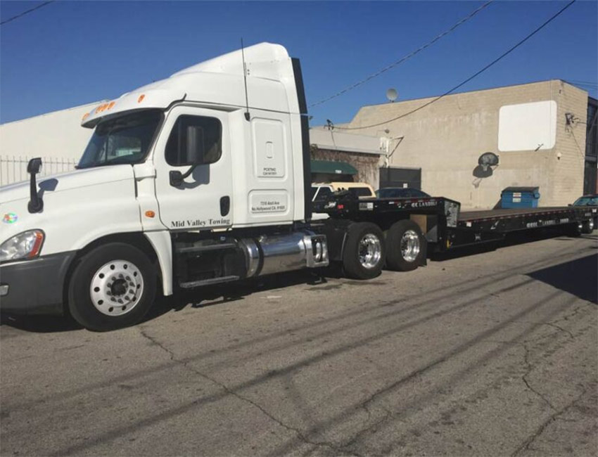 Semi-Truck-Towing-Landoll-Transport Semi Truck Towing