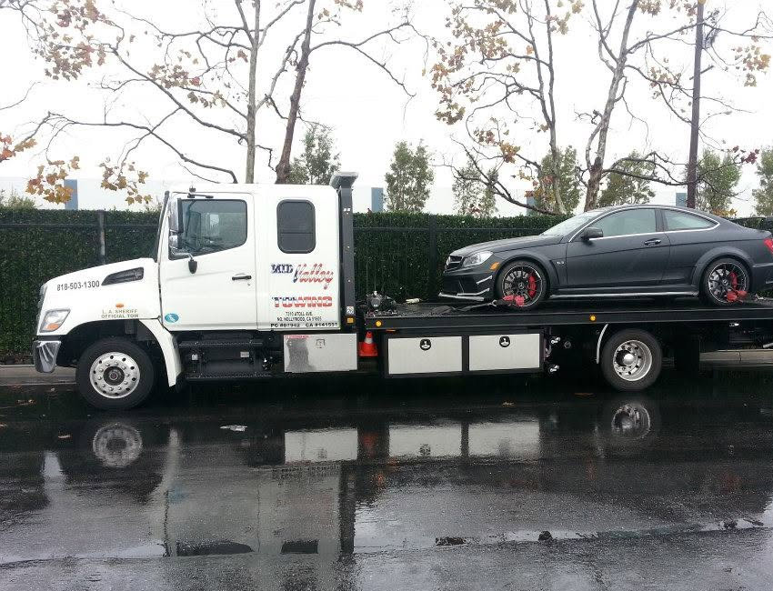 Grey-sedan-on-Mid-Valley-Towing-Flatbed-Tow-Truck-in-North-Hollywood-California Grey Sedan on Mid Valley Towing Flatbed Tow Truck in North Hollywood California